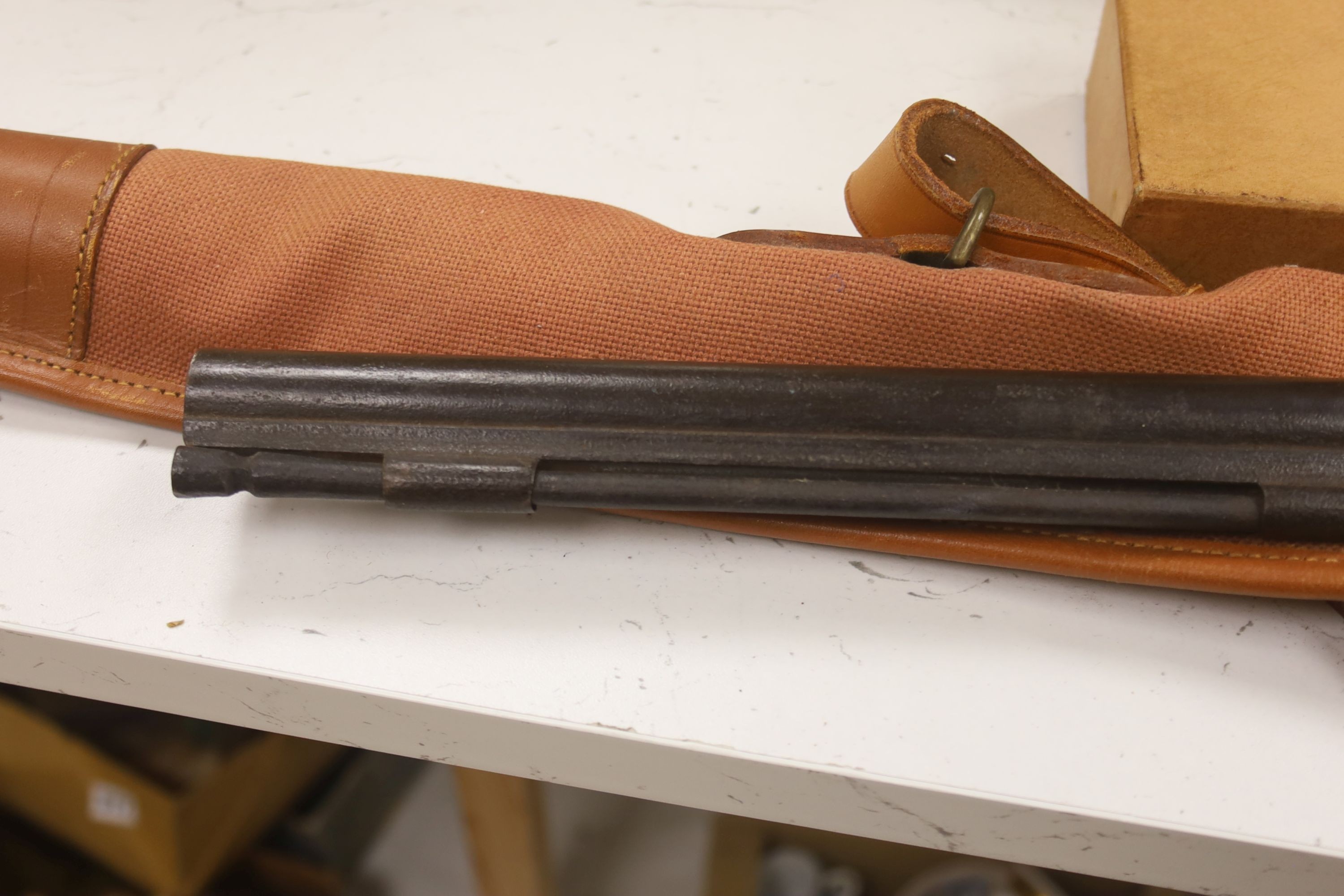 A 19th century percussion rifle, walnut stock, with ram rod, in canvas case, complete with gun cleaning kit